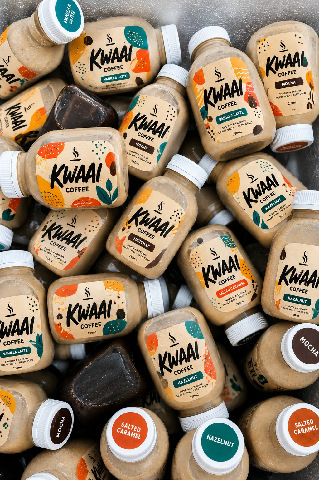 KWAAI Coffee bottles in a cooler